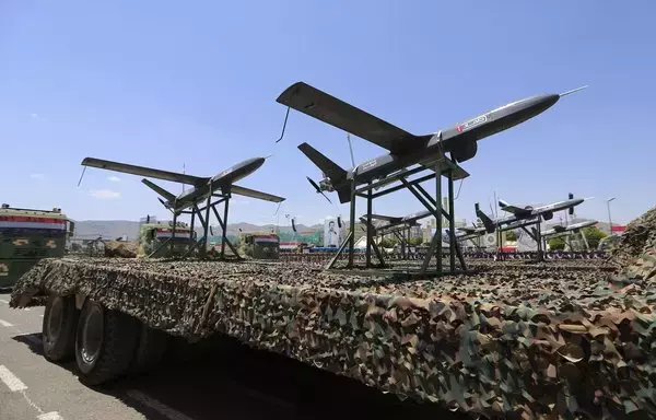 Drones are displayed on the back of a vehicle during a Houthi military parade marking the ninth anniversary of the Iran-backed group's seizure of Sanaa on September 21. [Mohammed Huwais/AFP]