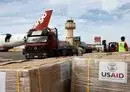 
Workers unload humanitarian aid at Egypt's al-Arish Airport on November 22, ahead of being transported to the Rafah border crossing with Gaza. [Khaled Desouki/AFP]        