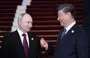 
Russia's President Vladimir Putin and Chinese President Xi Jinping interact on October 17 in Beijing. [Sergei SAVOSTYANOV / POOL / AFP]        