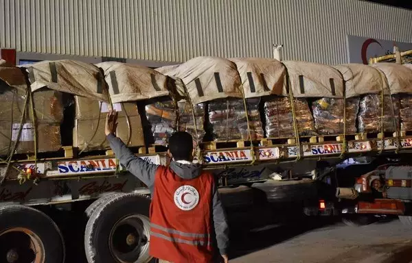 Volunteers at Egyptian Red Crescent logistics services centers in North Sinai, Cairo and Ismailia work to receive, sort and prepare urgent humanitarian aid before sending it into the Gaza strip. A volunteer is seen directing a truck loaded with aid in a photo posted December 18 on social media. [Egyptian Red Crescent/Facebook]