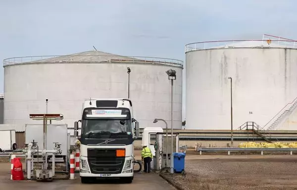 A tanker is refilled with crude oil at the BP oil refinery in Hamble, near Southampton, England, on October 4, 2021. BP has suspended transit through the Red Sea following Houthi attacks on shipping lanes in the strategic waterway. [Adrian Dennis/AFP]