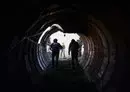 
In this picture taken during a media tour organized by the Israeli military on December 15, journalists visit a tunnel that Hamas reportedly used to attack Israel through the Erez border crossing on October 7. The Israeli army said on December 17 it had uncovered the biggest Hamas tunnel in the Gaza strip so far, just a few hundred meters from the Erez border crossing. [Jack Guez/AFP]        