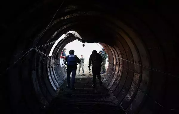 In this picture taken during a media tour organized by the Israeli military on December 15, journalists visit a tunnel that Hamas reportedly used to attack Israel through the Erez border crossing on October 7. The Israeli army said on December 17 it had uncovered the biggest Hamas tunnel in the Gaza strip so far, just a few hundred meters from the Erez border crossing. [Jack Guez/AFP]