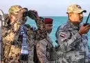 
Brig. Gen. Tariq Muhammad Abdullah Saleh, member of the Presidential Command Council in Yemen's internationally recognized government, looks through binoculars as he observes coastguard members patrolling in the Red Sea off the town of Mokha in Taez province, near the strategic Bab al-Mandeb strait, on December 12. [Khaled Ziad/AFP]        