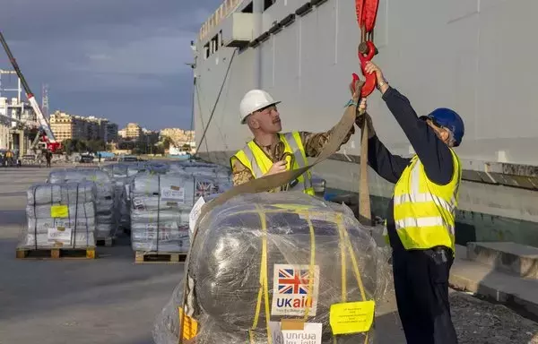 Close to 90 tons of thermal blankets and other essential items are unloaded from Royal Fleet Auxiliary ship Lyme Bay in Egypt's Port Said in early January as part of the first UK maritime shipment of lifesaving aid to civilians in Gaza. [UK Royal Navy]