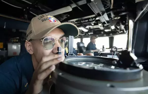 US Navy and Coast Guard officers aboard USS Laboon chart a course in support of Operation Prosperity Guardian. [Combined Maritime Forces]