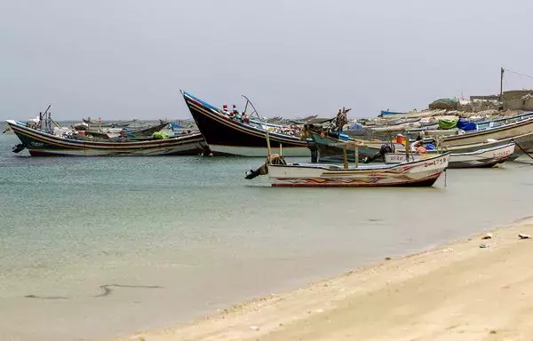 Fishing boats are moored near Yemen's Red Sea port of Ras Issa in the western province of al-Hodeidah last June 12. The Houthis' use of drone boats against vessels in the Red Sea will negatively affect Yemen's fishing community, warn analysts. [Mohammed Huwais/AFP]