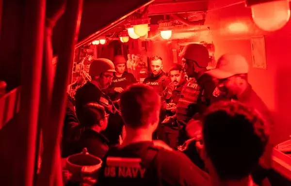 Sailors assigned to the Arleigh Burke-class guided-missile destroyer USS Mason (DDG 87) discuss team assignments while the ship operates in support of Operation Prosperity Guardian in the Red Sea, on January 3. [US Navy]