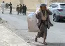 
A Yemeni man collects plastic waste from the streets in the capital Sanaa on March 19, 2022. [Mohammed Huwais/AFP]        