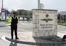 
Police officers stand guard at the gates of the Royal Air Force Akrotiri base, a British overseas facility near the Cypriot city of Limassol, on January 14. [Iakovos Hatzistavrou/AFP]        