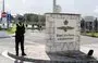 
Police officers stand guard at the gates of the Royal Air Force Akrotiri base, a British overseas facility near the Cypriot city of Limassol, on January 14. [Iakovos Hatzistavrou/AFP]        