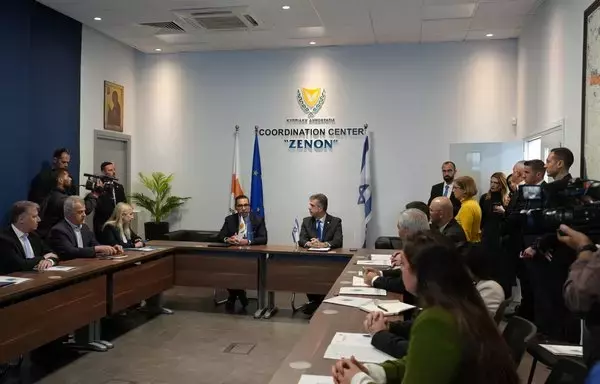 Israeli Foreign Minister Eli Cohen (L) and his Cypriot counterpart Constantinos Kombos discuss a humanitarian aid corridor from the Mediterranean island to Gaza on December 20. [Elisa Amouret/AFP]