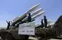 
Houthi fighters stand guard on a missile carrier during a military parade in Sanaa on September 21, 2023. [Mohammed Huwais/AFP]        