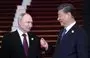
Russian President Vladimir Putin and Chinese President Xi Jinping interact during a welcoming ceremony at the Third Belt and Road Forum in Beijing on October 17. [Sergei Savostyanov/Pool/AFP]        