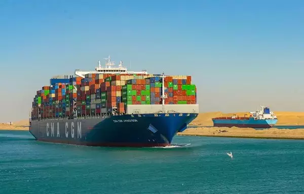 A container ship transits the Suez Canal on January 13. [Suez Canal Authority]