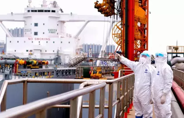 Immigration inspection officers check an oil tanker carrying imported crude oil at Qingdao port in China's eastern Shandong province on May 9, 2022. [AFP/CHINA OUT]