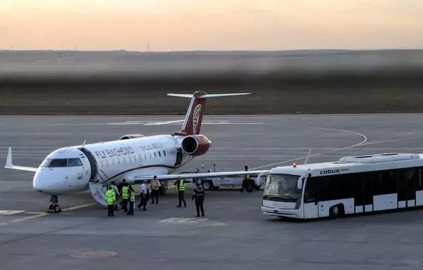 A Fly Baghdad Bombardier CRJ-200ER is seen here on the tarmac at Erbil International Airport in Iraq's Kurdish region in a photo taken December 24, 2019. [Safin Hamid/AFP]