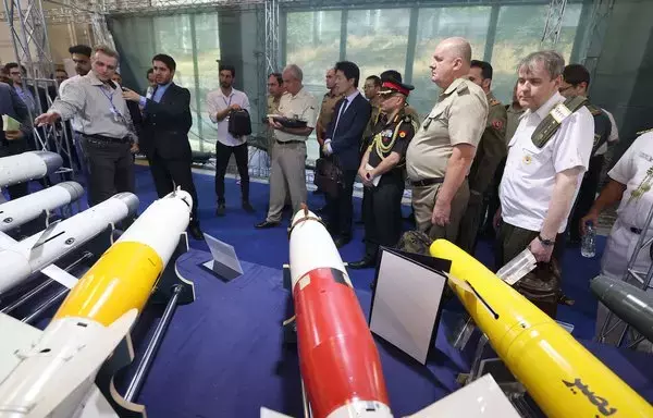 Foreign military advisers visit Iran's defense industry achievement exhibition in Tehran on August 23. Iran unveiled on August 22 its latest domestically built drone that can fly at a higher altitude and for a longer duration with enhanced weapon capabilities, state media reported. [Atta Kenare/AFP]