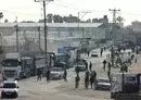 
Trucks carrying humanitarian aid enter Rafah in the southern Gaza strip after crossing the terminal border from Egypt, on January 17. [AFP]        