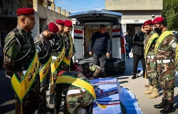 Elements of the Kataib Hizbullah militia mourn one of their leaders, Ali Anwar Subeih al-Saadi, who was killed in the recent US air strikes on the militia's strongholds in Jurf al-Sakhr and al-Qaim. [Kataib Hizbullah]