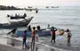 
Fishermen unload their catch from a boat in al-Khokha district of Yemen's al-Hodeidah province on January 16. The Houthis have reportedly recruited fishermen to smuggle arms into the country. [Khaled Ziad/AFP]        