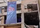 
A photograph taken January 8 shows a banner depicting Hizbullah chief Hassan Nasrallah on a building hit by a drone attack that killed a Hamas leader in Beirut's southern suburb on January 2. Hizbullah operates a joint operations room with other Iranian proxies in Beirut. [Anwar Amro/AFP]        