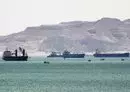 
This picture taken March 28, 2021, shows tanker and freight ships near the entrance of the Suez Canal. [Ahmed Hasan/AFP]        