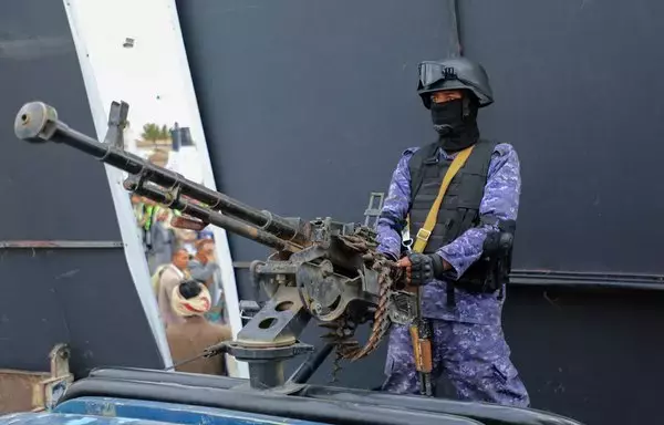 A Houthi fighter mans a gun during a rally in Sanaa on February 9. [Mohammed Huwais/AFP]