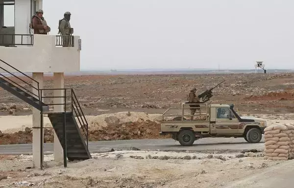 Jordanian soldiers patrol along the border with Syria to prevent trafficking on February 17, 2022. [Khalil Mazraawi/AFP]