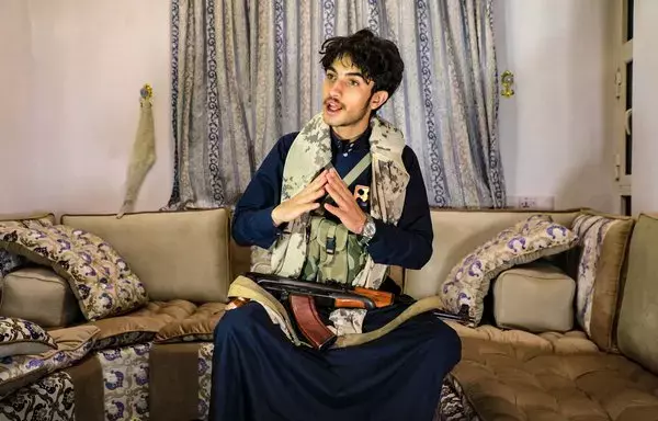 Yemeni TikToker and influencer Rashed Al-Haddad, 19, answers questions during an interview at his home in Houthi-controlled capital Sanaa on January 18. Al-Haddad received millions of views for his filmed trip to the Galaxy Leader, a vehicle carrier the Houthis hijacked in November. [Mohammed Huwais/AFP]