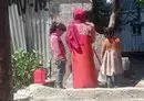 
Girls fetch water for their families from public water tanks in Sanaa. [Yazan Abdulaziz/Al-Fassel]        