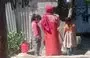 
Girls fetch water for their families from public water tanks in Sanaa. [Yazan Abdulaziz/Al-Fassel]        