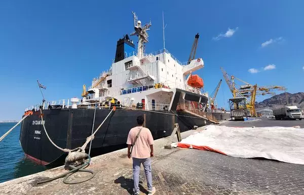 US-owned, Greek-flagged ship Sea Champion is pictured in the city of Aden, on February 21, a day after it was targeted by the Houthis in the Gulf of Aden. [Saleh al-Obeidi/AFP]