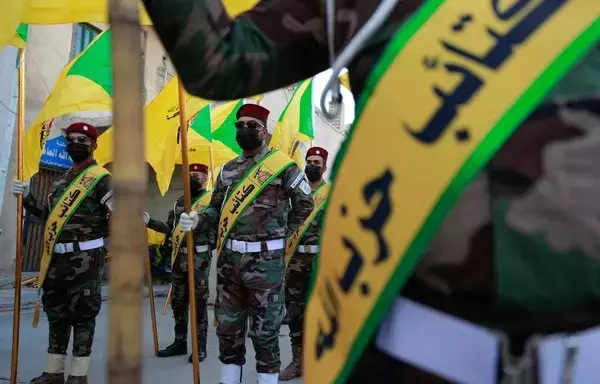 Kataib Hizbullah elements attend the November 21 funeral in Baghdad of Fadel al-Maksusi, a fighter who was also part of the so-called 'Islamic Resistance in Iraq,' the group that has claimed all recent attacks on US troops in Iraq and Syria. [Ahmad al-Rubaye/AFP]