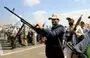 
Armed Yemenis display smuggled weapons during a parade in Sanaa on March 9. [Mohammed Huwais/AFP]        