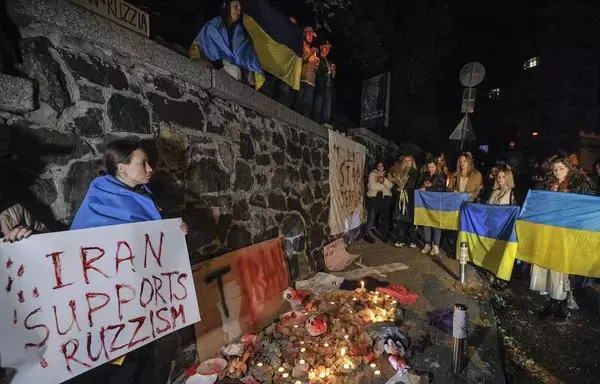 People demonstrate outside the Iranian embassy in Kyiv, Ukraine, on October 17, 2022, after the city was hit by swarms of drones sold by Iran to Russia. [Sergei Chuzavkov/AFP]