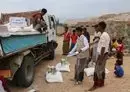 
Yemenis on the island of Socotra receive food aid donated by the World Food Program last October. [World Food Program]        