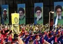 
Scouts loyal to Hizbullah salute during a procession in Lebanon's southern city of Nabatiyeh on August 12, 2022, as they march past posters of Hizbullah's slain military leader Imad Moghniyeh, current leader Hassan Nasrallah, Iran's leader Ali Khamenei and late supreme leader Rouhollah Khomeini. [Mahmoud Zayyat/AFP]        