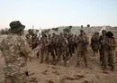 
Fighters from the militant group Hayat Tahrir al-Sham, headed by ex-members of Syria's former al-Qaeda franchise, stand to attention during a military training graduation ceremony in the country's opposition-held northwestern Idlib province on August 16, 2023. [Omar Haj Kadour/AFP]        