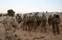 
Fighters from the militant group Hayat Tahrir al-Sham, headed by ex-members of Syria's former al-Qaeda franchise, stand to attention during a military training graduation ceremony in the country's opposition-held northwestern Idlib province on August 16, 2023. [Omar Haj Kadour/AFP]        