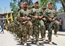 
Hizbullah fighters take part in a parade in the eastern Bekaa Valley on May 25, 2022. [AFP]        