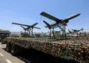 
Drones are displayed on the back of a vehicle during a military parade in Sanaa last September 21 marking the ninth anniversary of the Houthis' coup. [Mohammed Huwais/ AFP]        