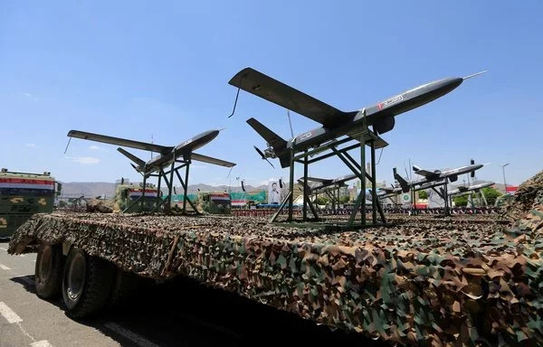 Drones are displayed on the back of a vehicle during a military parade in Sanaa last September 21 marking the ninth anniversary of the Houthis' coup. [Mohammed Huwais/ AFP]