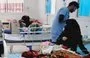 
Parents sit beside their children who are suffering from hemolysis at the emergency department in Al-Sabeen Hospital in Sanaa. [Photo courtesy of Yazan Abdul Aziz]        