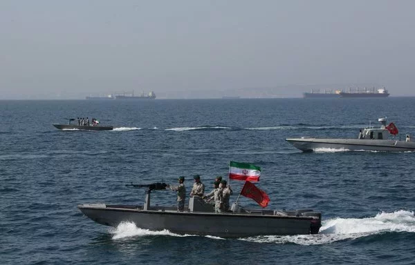 Iranian military vessels are seen in the Strait of Hormuz on April 30, 2019. [Atta Kenare/AFP]