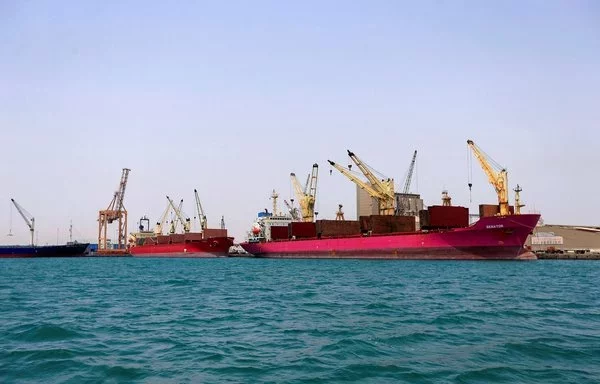 Ships are docked for unloading in Yemen's Houthi-held port of al-Hodeidah last July 15. [Mohammed Huwais/AFP]