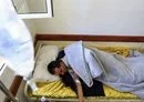 
A Yemeni man lies on a bed at a cholera treatment center in Sanaa on April 25, 2019. [Mohammed Huwais/AFP]        