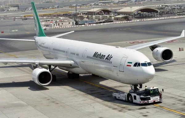 A picture taken on September 14, 2017, shows a Mahan Air Airbus at Dubai International Airport. [Giuseppe Cacace/AFP]