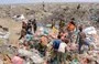 
Youths collect recyclable items at a garbage dump in Yemen's Red Sea port city of al-Hodeidah last August 15. [AFP]        