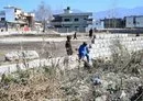 
Boys play at the site of the demolished compound of slain former al-Qaeda leader Osama bin Laden, on February 11, 2021, in northern Abbottabad, Pakistan. [Farooq Naeem/AFP]        